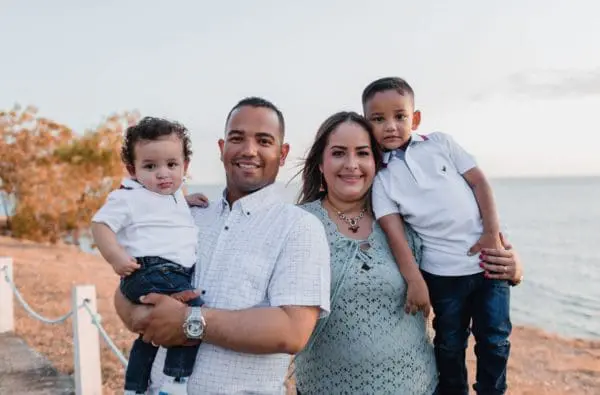 Parents and kids posing for picture