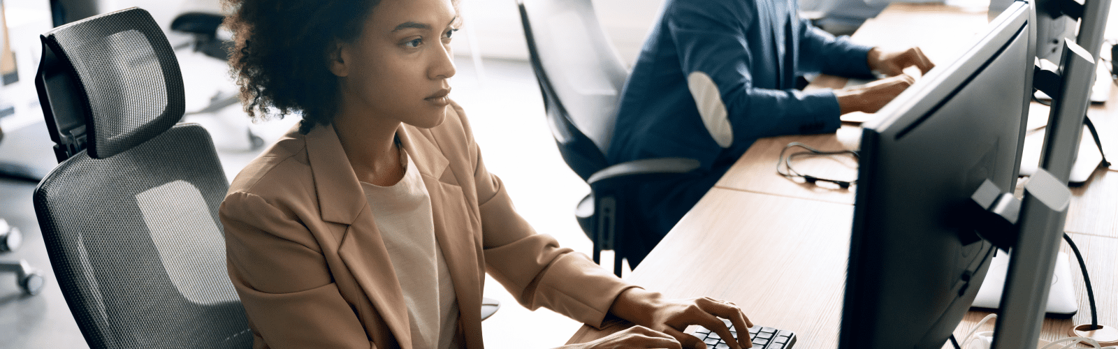 Woman on computer at office.