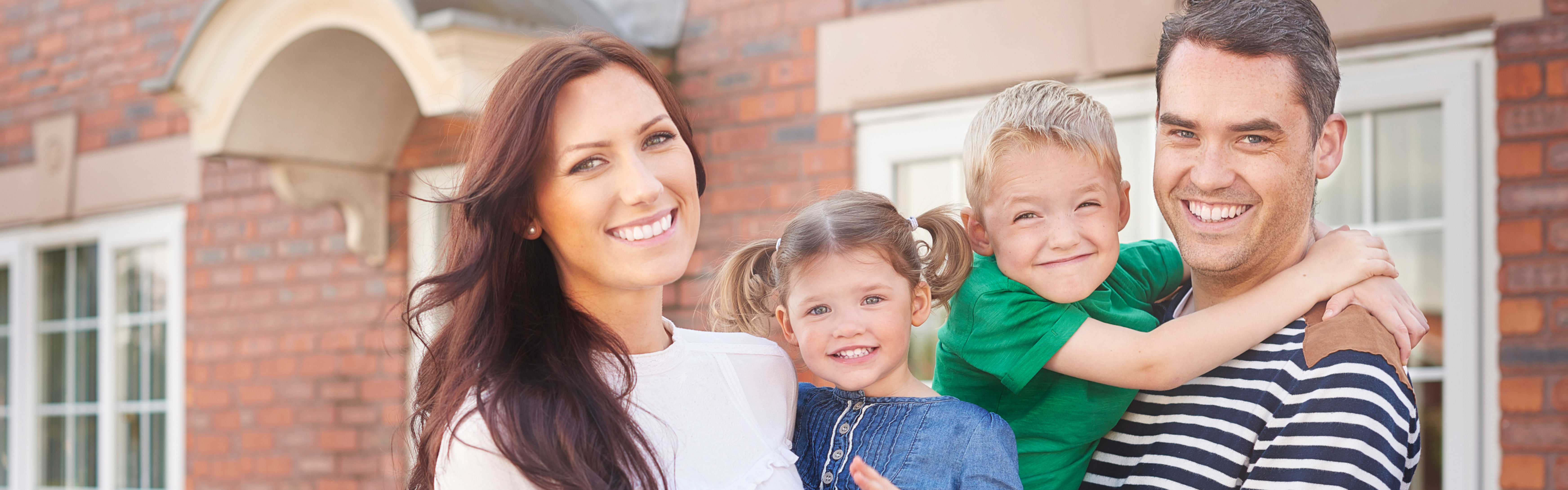 Family in front of house