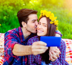 couple posing outside for a selfie