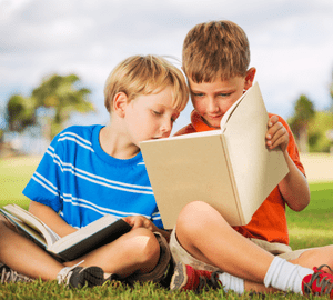 two boys reading books