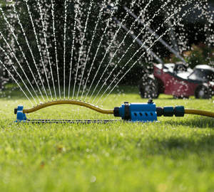 running water sprinkler on the lawn
