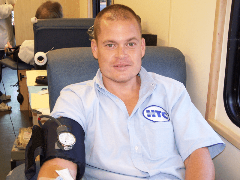 An HTC employee donating blood.  The American Red Cross bloodmobile visits the Corporate Office on a quarterly basis.