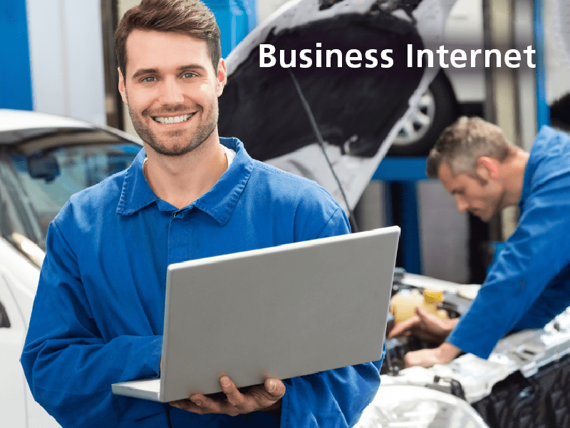 Man on computer in repair shop