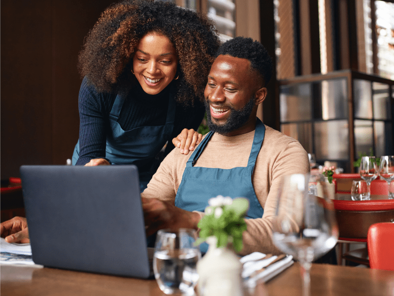 Business owners working on laptop