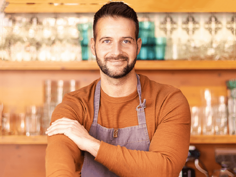 Confident business owner smiling at the camera