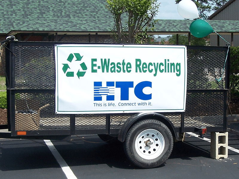 HTC providing a way for members to dispose of paper waste at a local recycling event.