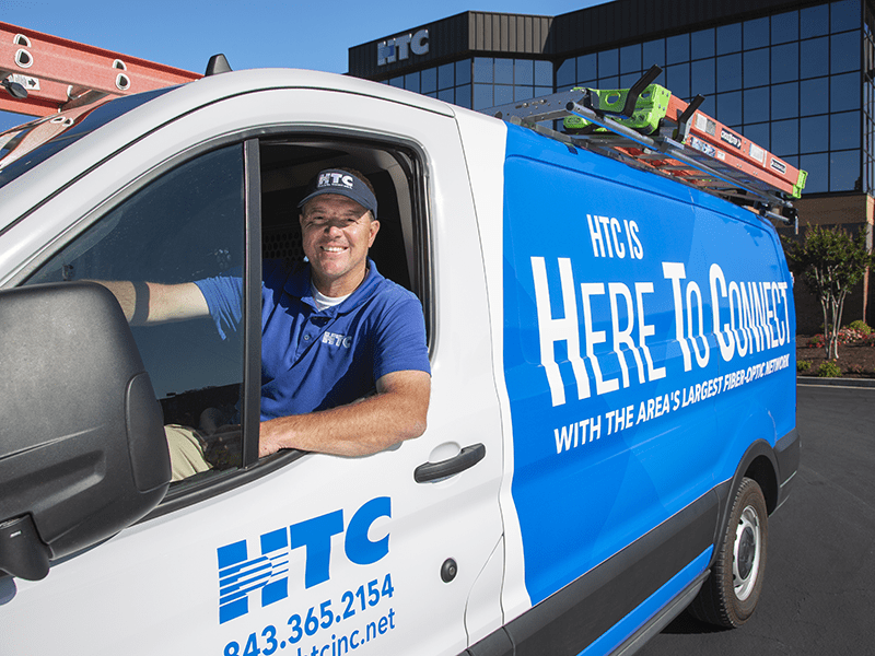 HTC technician in van.