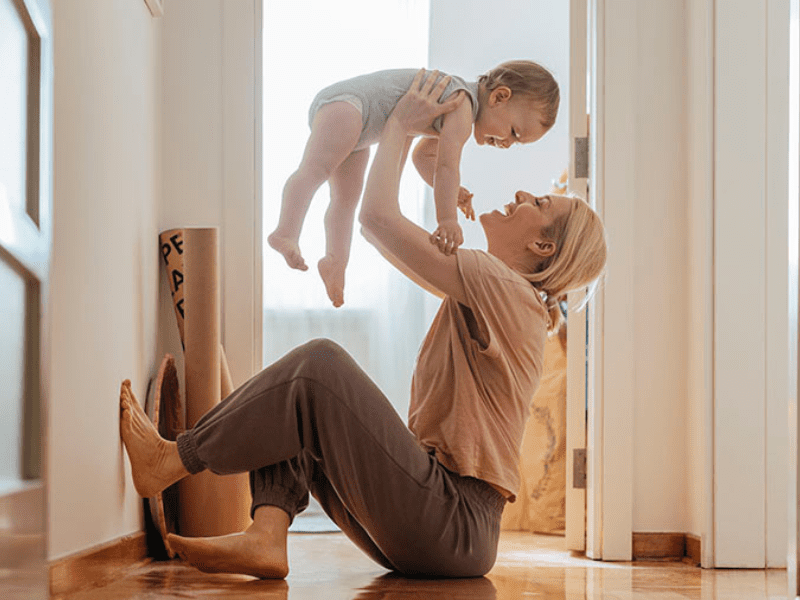 Woman playing with baby