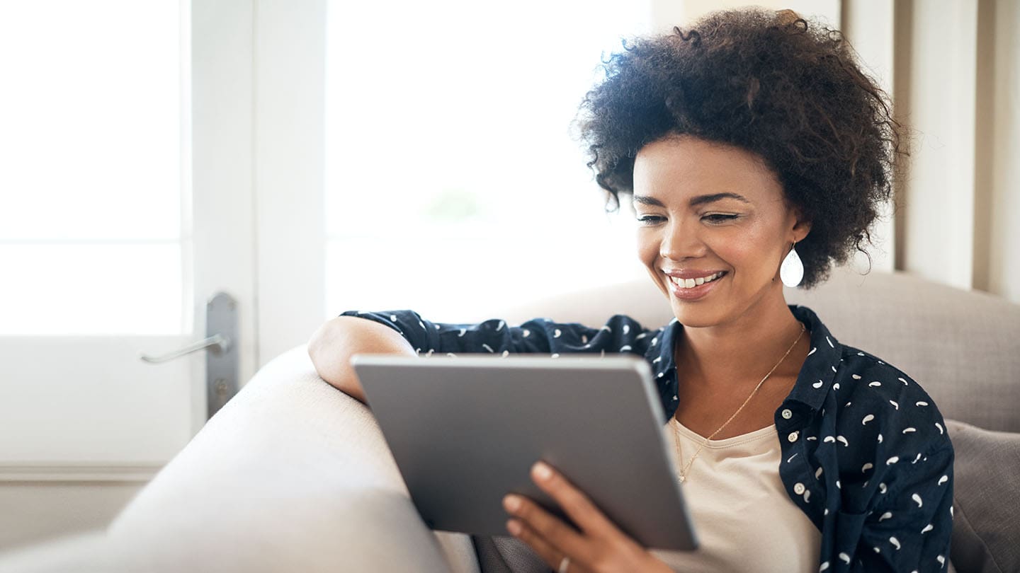 young woman looking at her tablet