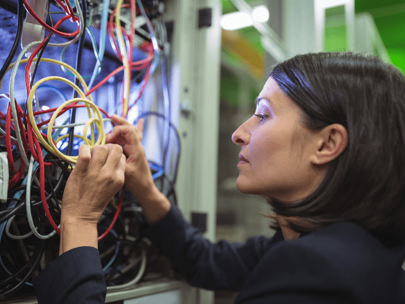 Woman working on network wiring