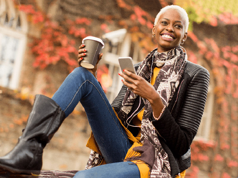 Woman outside enjoying a coffee