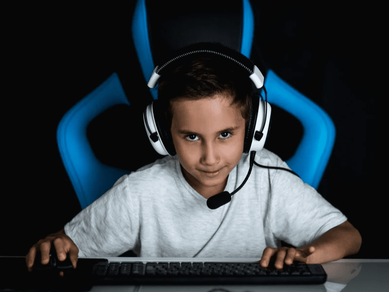 Kid gaming on computer.