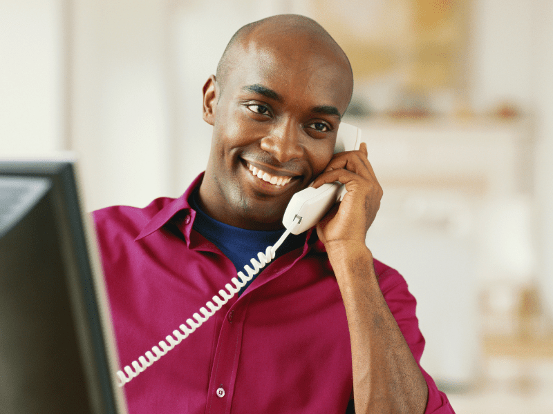 Man talking on landline.