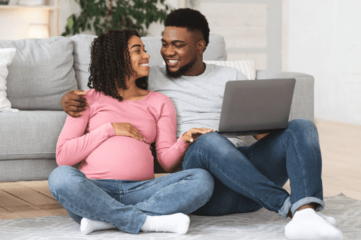 Expectant parents using laptop 