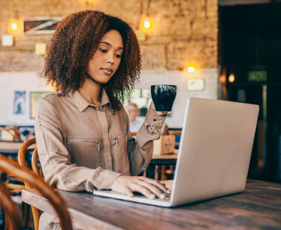 Woman using wifi at a coffee shop