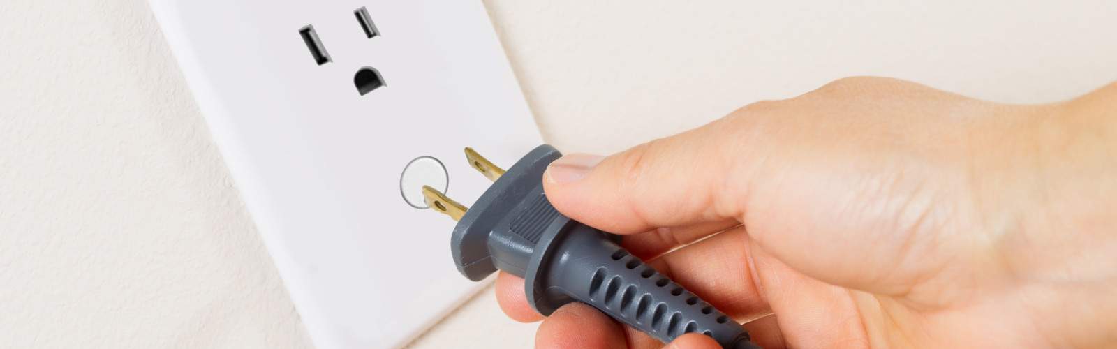 Person plugging into an outlet