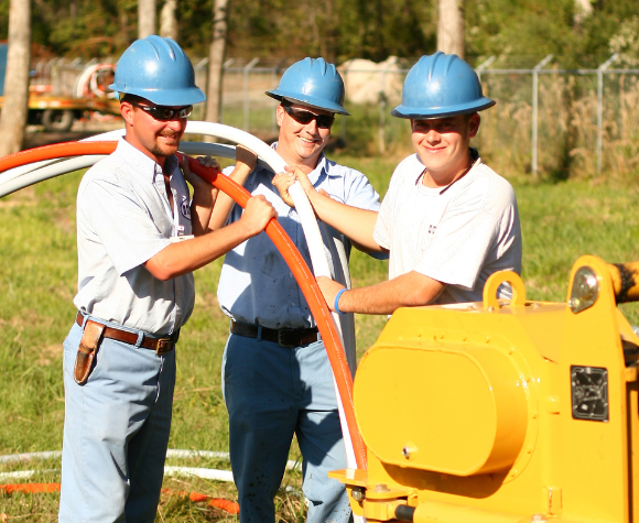 HTC crew installing fiber optic cables