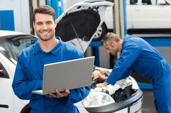 Mechanic using laptop