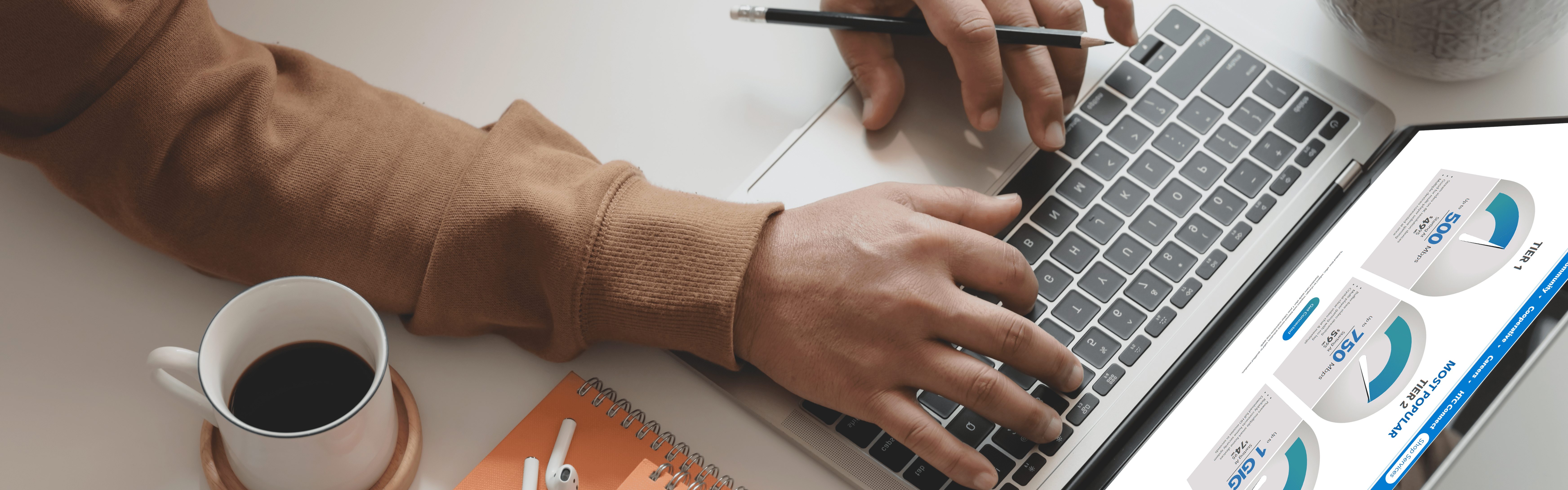 hands typing on laptop