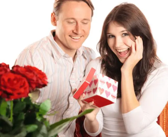 Woman opening valentine gift