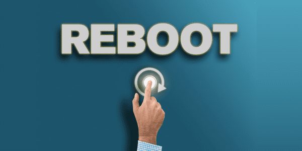 Hand pressing 'Reboot' button