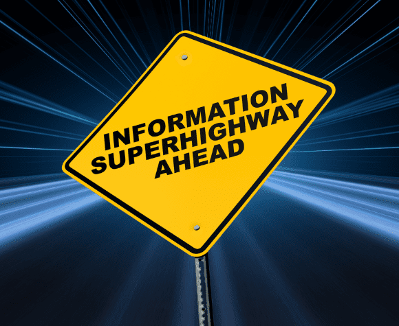 Yellow road sign stating 'information superhighway ahead'