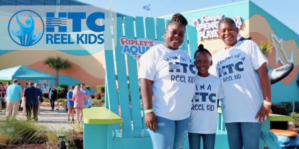 Family attends 2024 REEL Kids event at Ripley's Aquarium