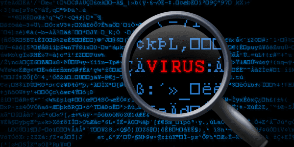 Magnifying glass hovering over 'virus' in computer code