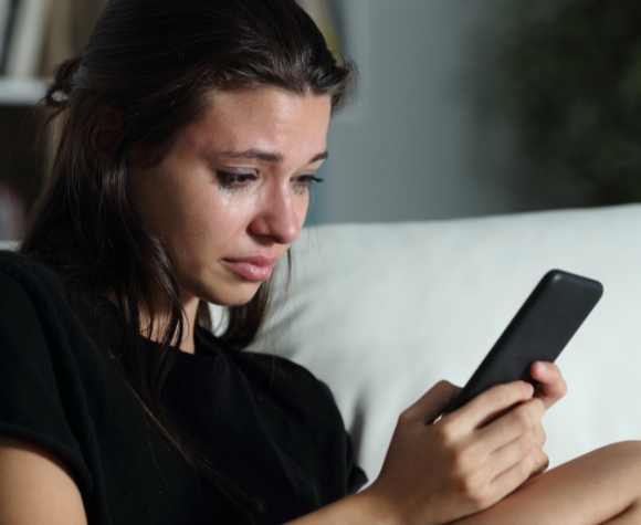 Teen being cyberbully-ed