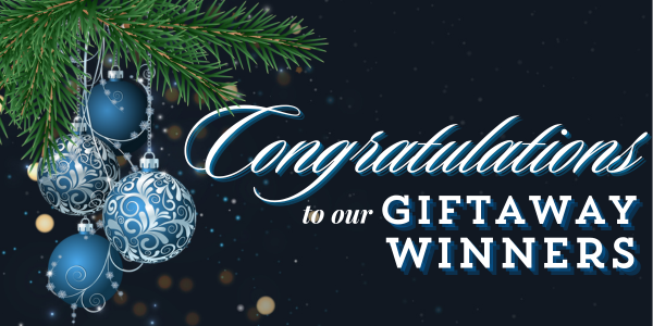 Ornaments hang from a pine branch with script reading "Congratulations to our Giftaway Winners" on a dark background