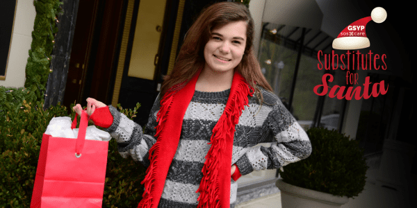 A smiling girl wearing a red scarf holds a red gift bag. A “Substitutes for Santa” logo appears in the image’s corner.