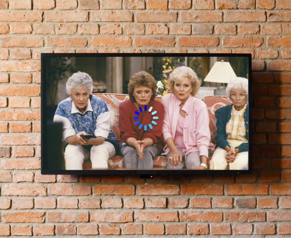 Golden girls on wall mount TV with a buffering screen