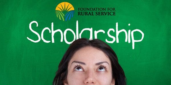 A woman’s head is seen with "Scholarship" written in chalk behind her, with the "Foundation for Rural Service" logo above.