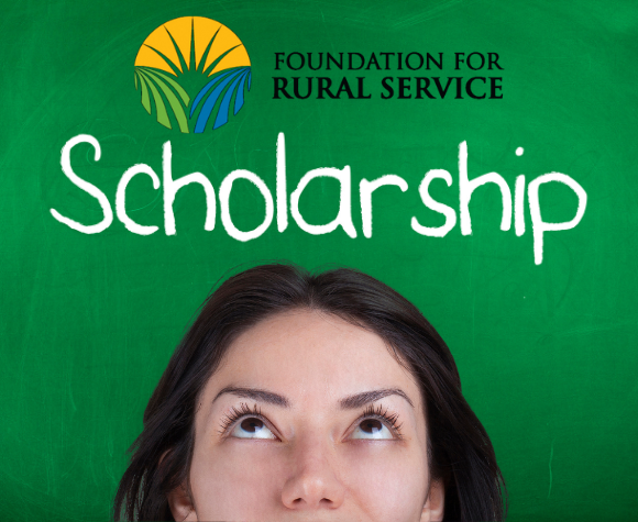 girl looking at word scholarship on chalkboard