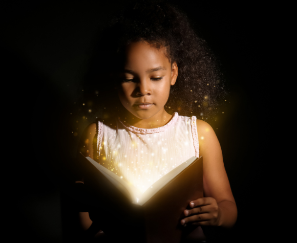 young girl unlocking her imagination with an open book