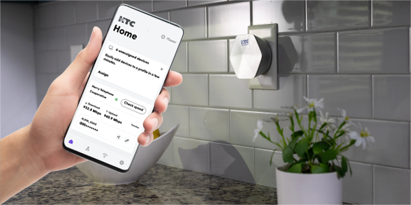 at home checking on internet speeds with Plume Home App.