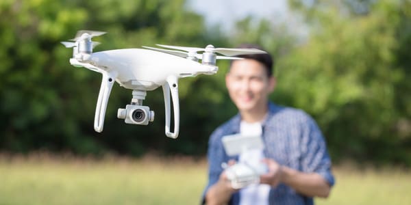 man flying a drone