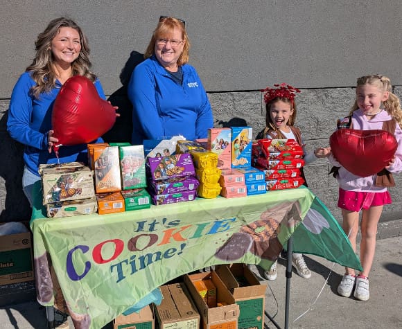 Troop 392 and HTC employees at a cookie event 2026
