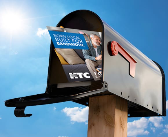 open mailbox with an HTC postcard