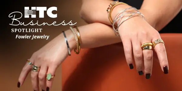 multiple bracelets and rings on a pair of hands