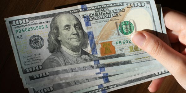 5-0 bills in hand
