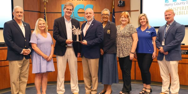 HTC employees at the HCS school board meeting 6.8.26