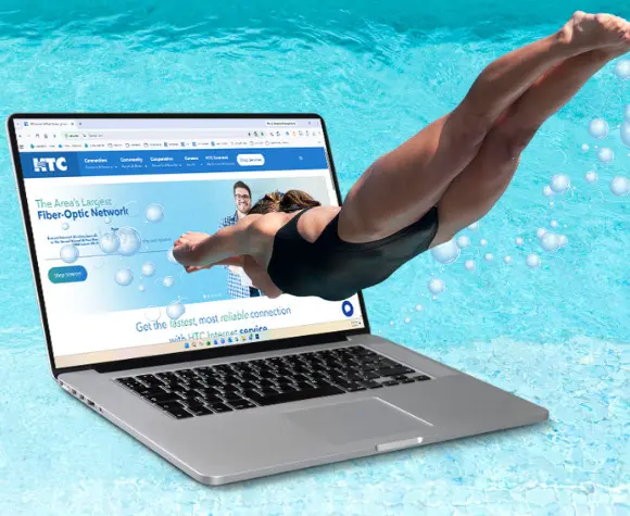 woman diving into water and heading for an underwater laptop open to HTC home page