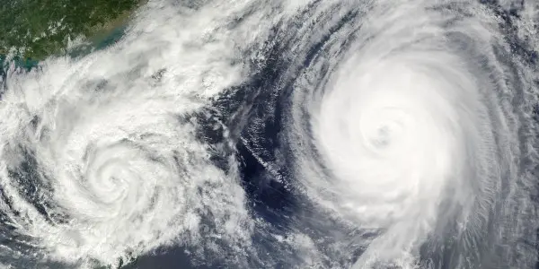 two hurricanes swirling in the ocean
