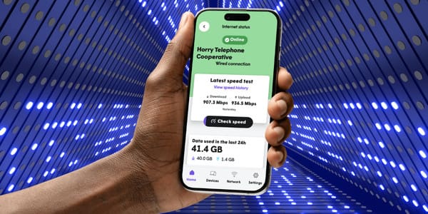 person holding cellphoen with updated plume home app