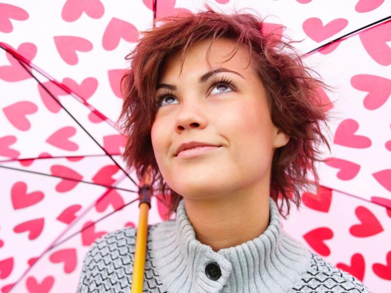 woman under heart umbrella