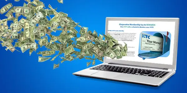 capital credits flying out of a laptop screen
